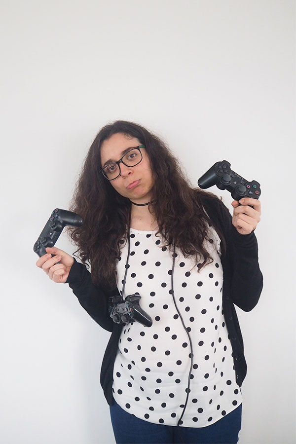 Woman holding console controllers